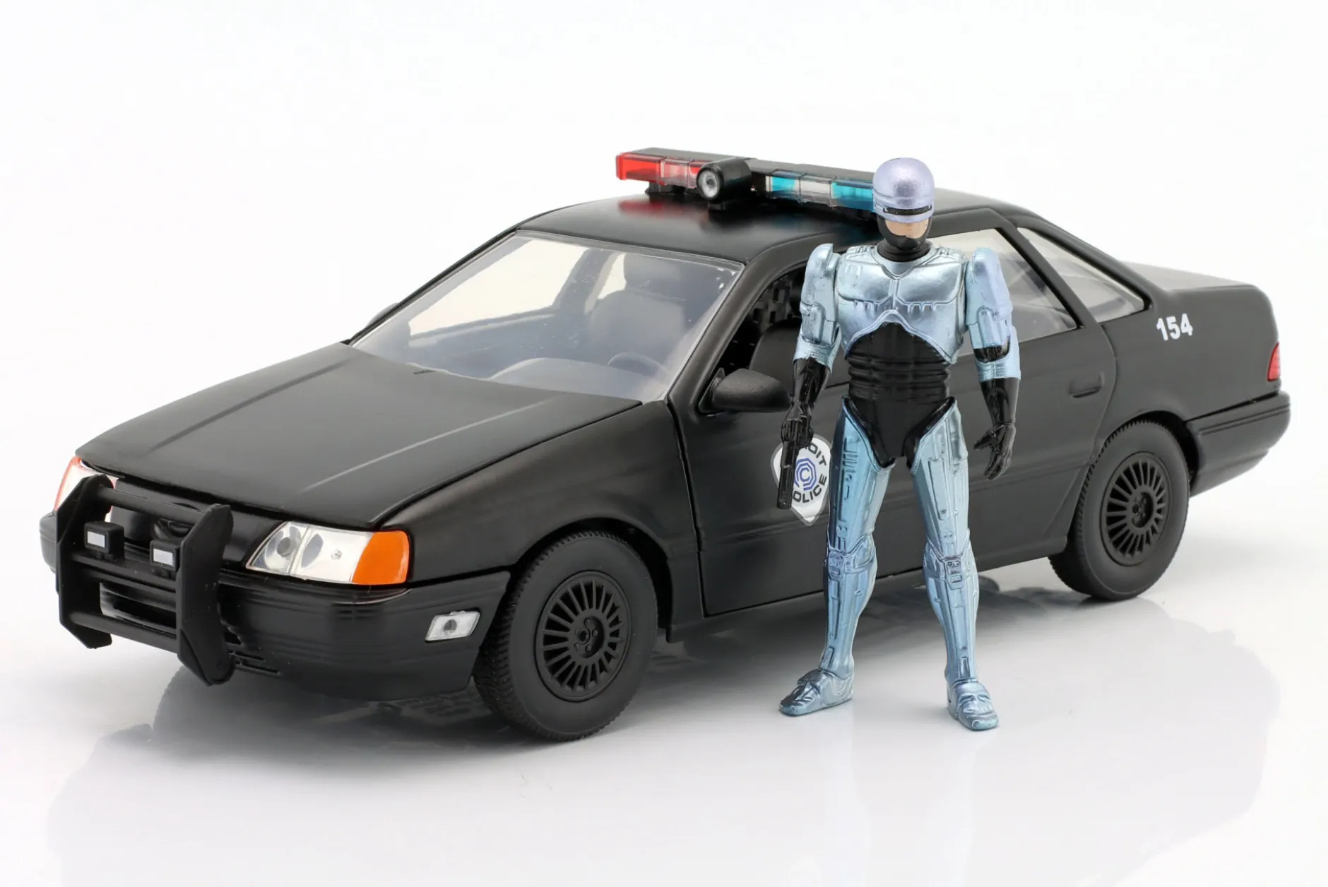 Ford Taurus OCP Baujahr 1986 Movie Robocop (1987) mit Figur 1:24 Jada Toys