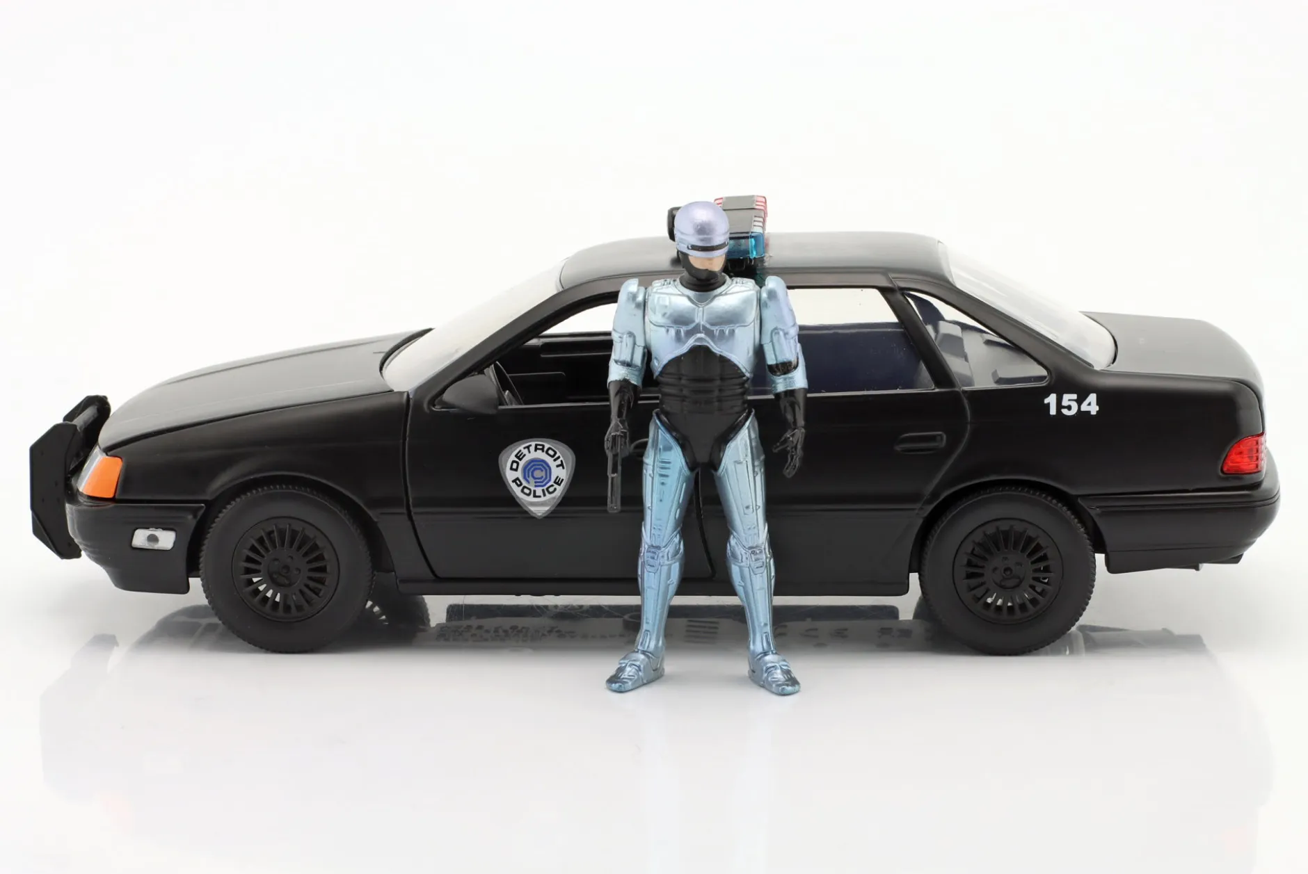 Ford Taurus OCP Baujahr 1986 Movie Robocop (1987) mit Figur 1:24 Jada Toys