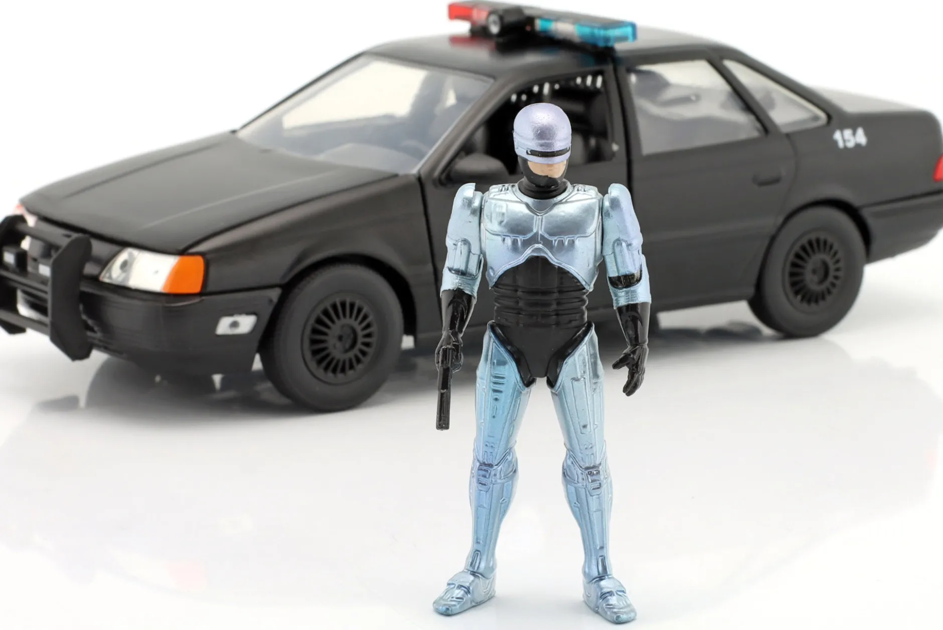 Ford Taurus OCP Baujahr 1986 Movie Robocop (1987) mit Figur 1:24 Jada Toys