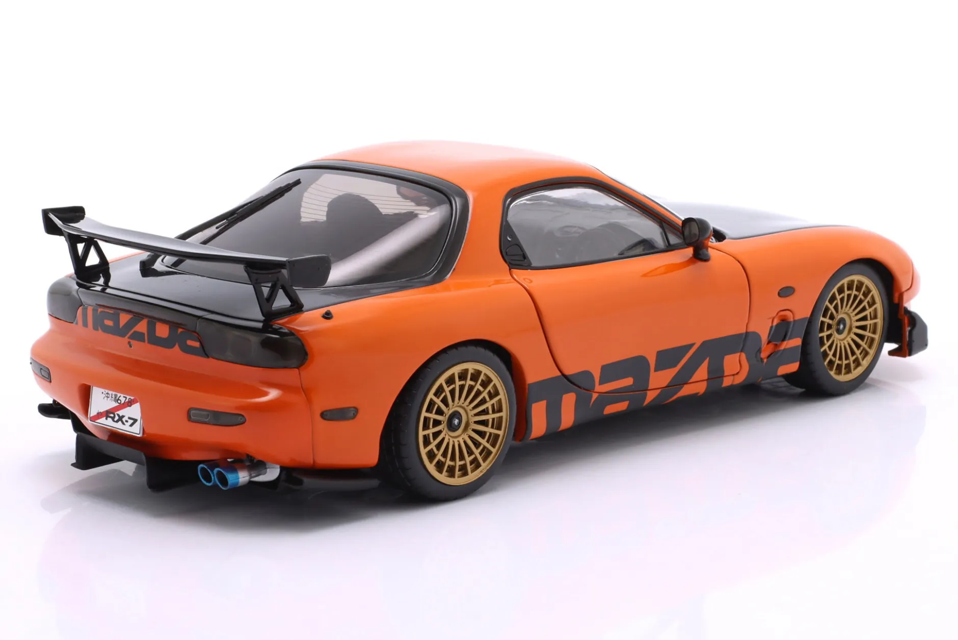 Mazda RX-7 Typ RS (FD3S) Baujahr 1999 orange / schwarz 1:18 Solido
