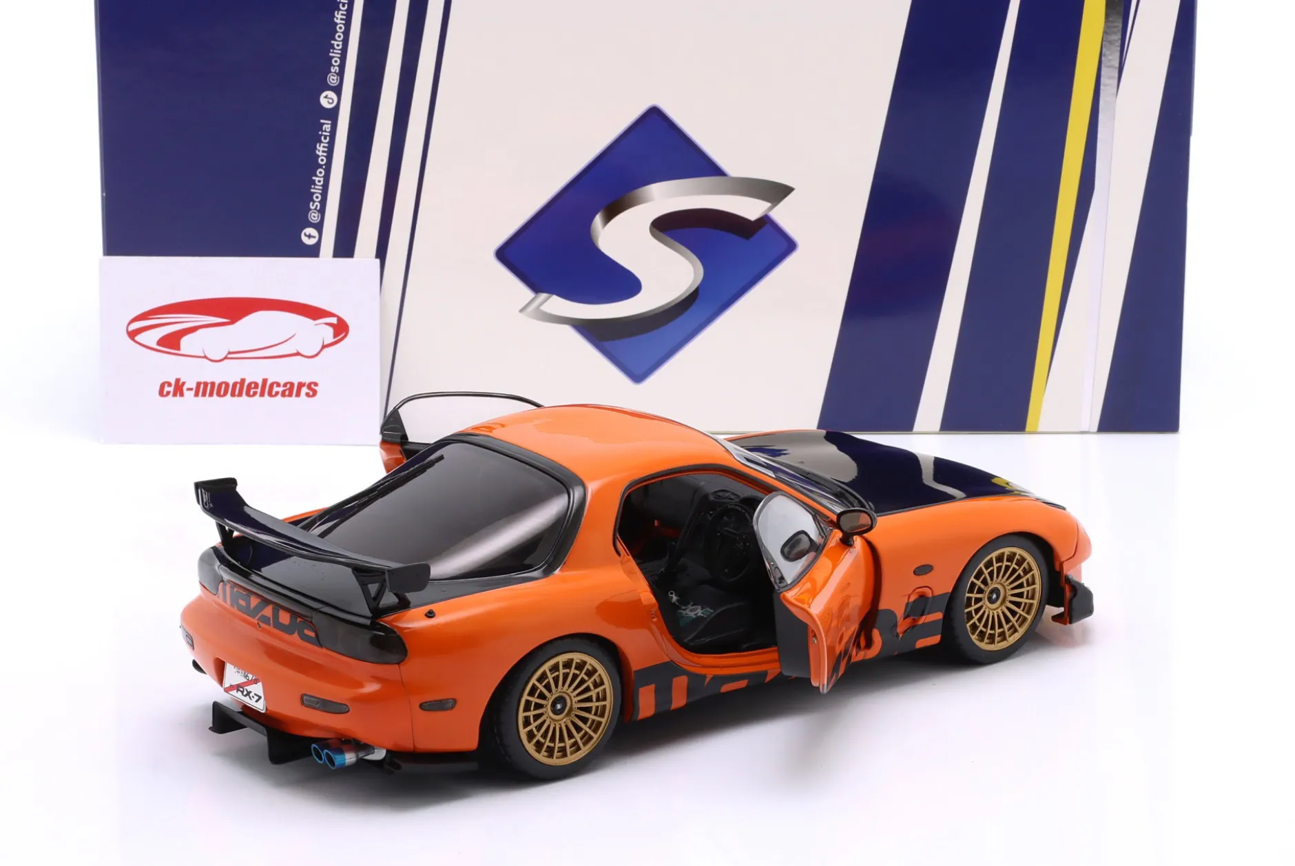 Mazda RX-7 Typ RS (FD3S) Baujahr 1999 orange / schwarz 1:18 Solido