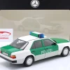 Mercedes-Benz 230E (W124) Polizei Baujahr 1989-1993 weiß / grün 1:18 Norev