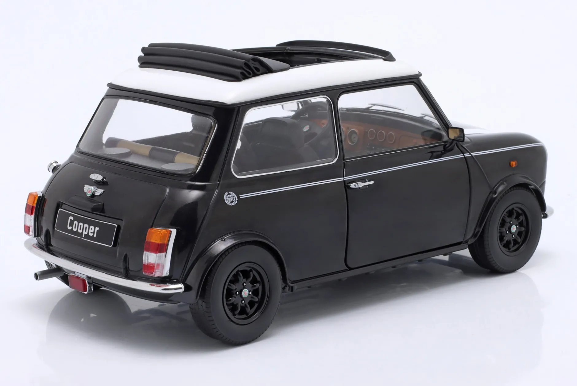 Mini Cooper mit Schiebedach schwarz metallic / weiß LHD 1:12 KK-Scale