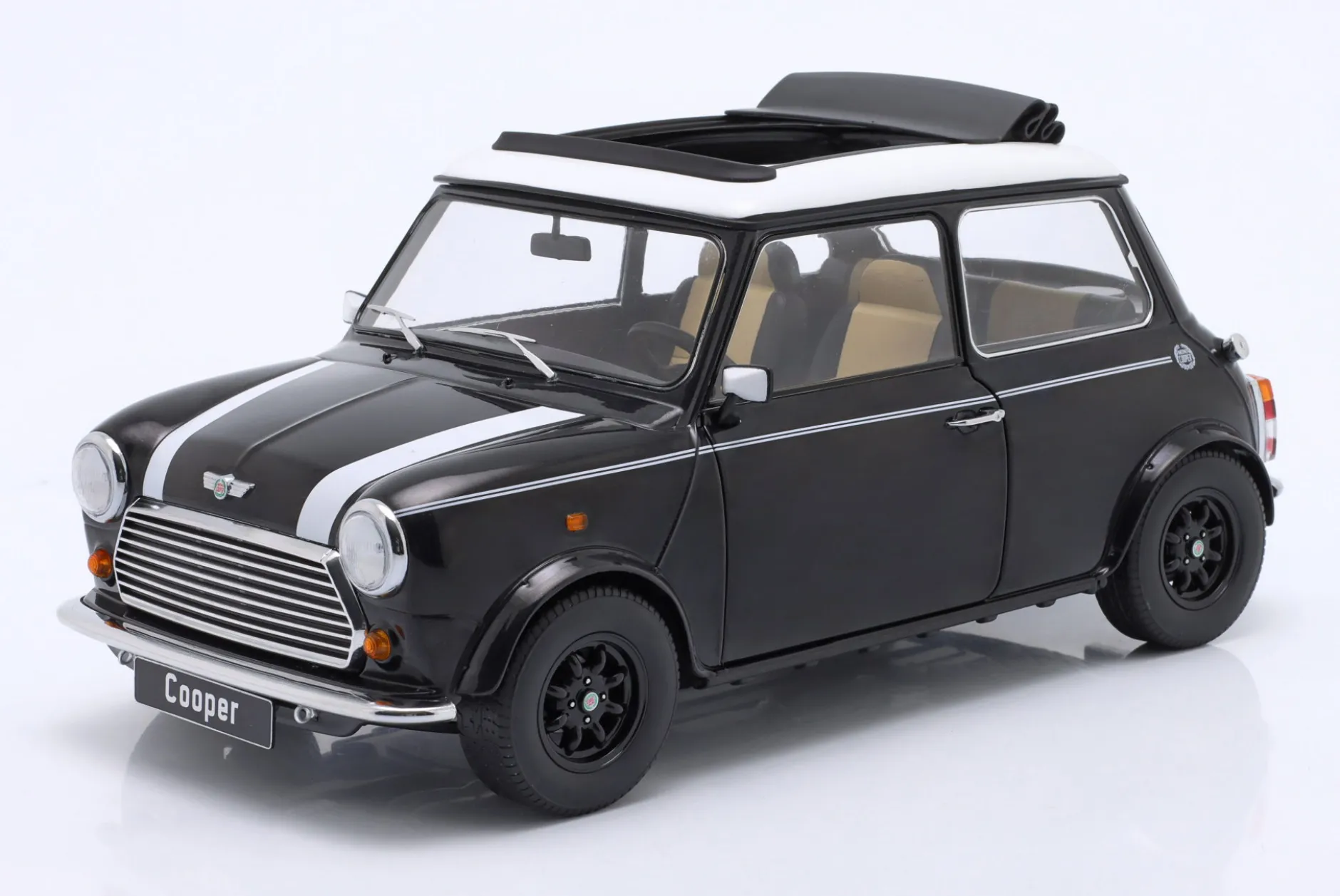 Mini Cooper mit Schiebedach schwarz metallic / weiß LHD 1:12 KK-Scale