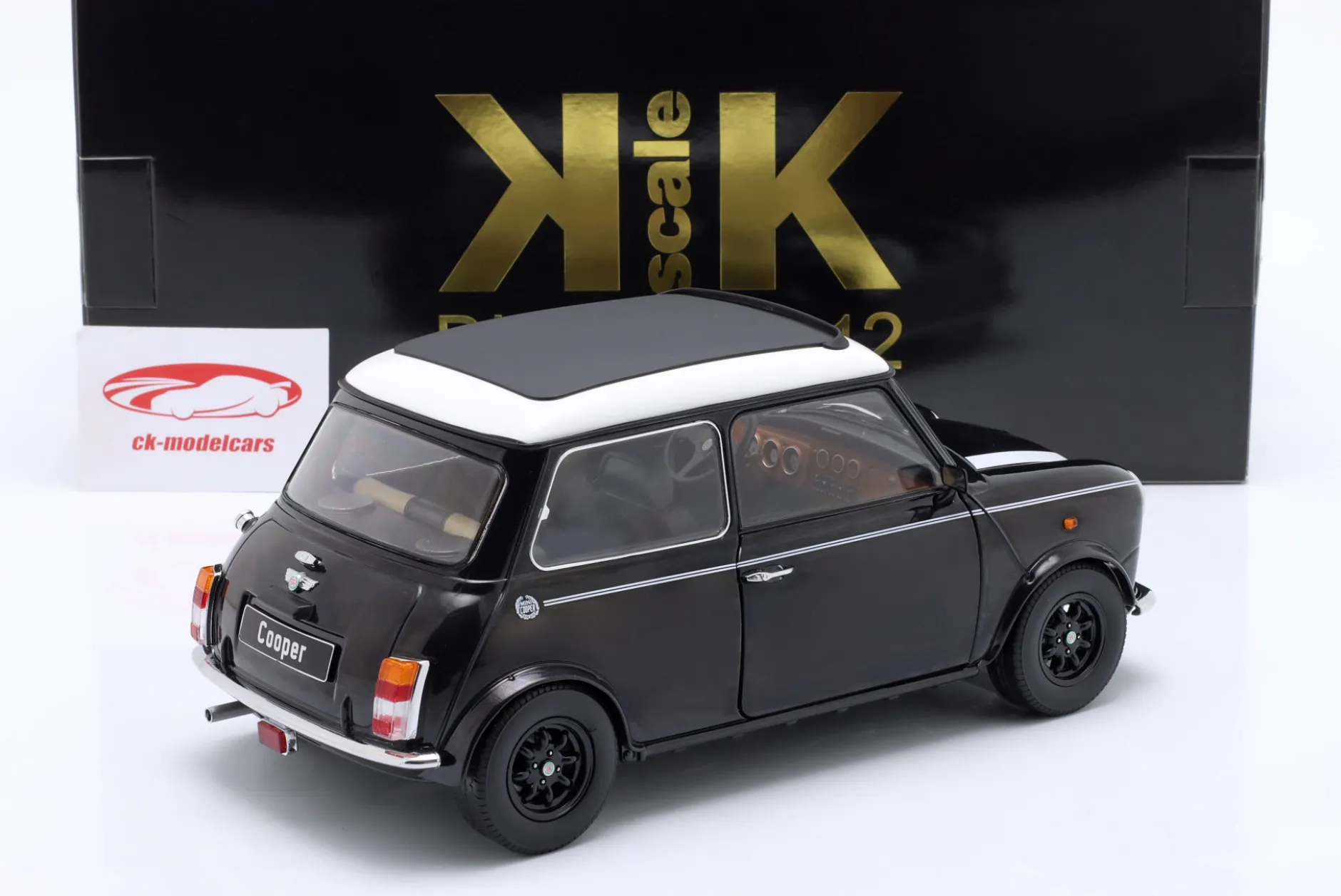 Mini Cooper mit Schiebedach schwarz metallic / weiß LHD 1:12 KK-Scale