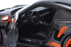 Porsche 911 (992) GT3 RS Baujahr 2022 schwarz / orange Felgen 1:18 Minichamps