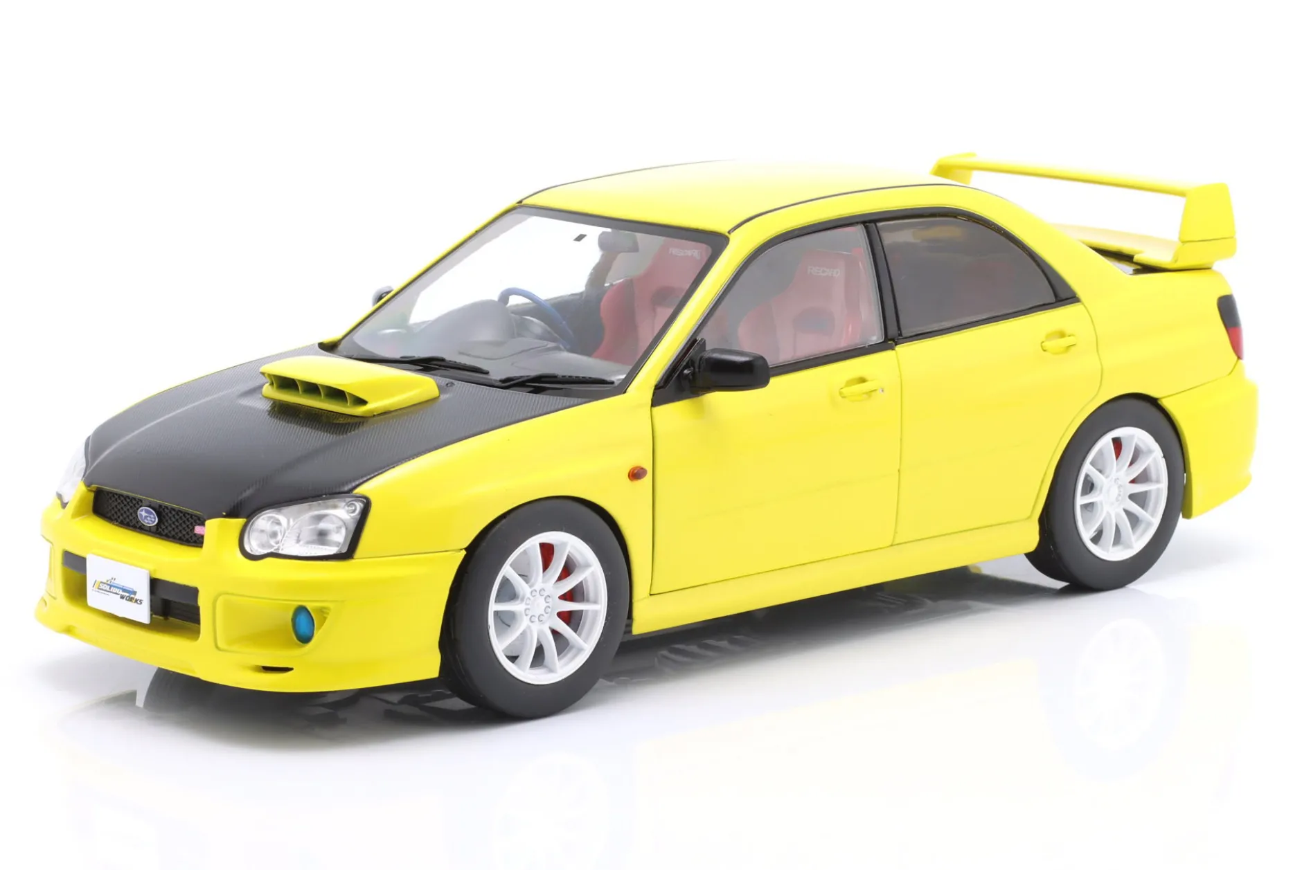 Subaru Impreza WRX STI Baujahr 2003 gelb / schwarz 1:18 Solido